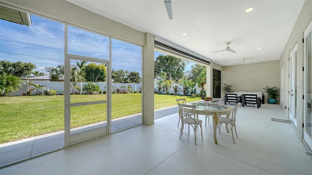 sunroom with a ceiling fan