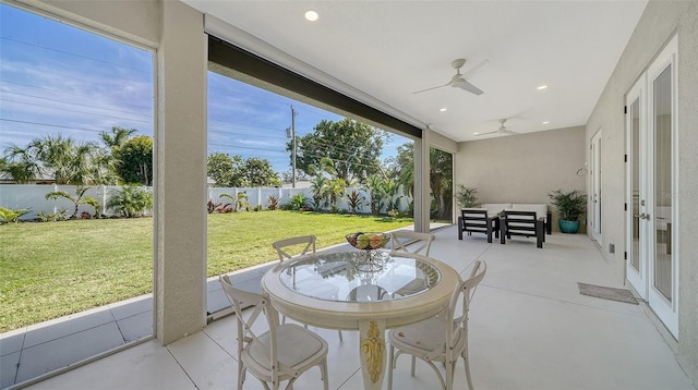 view of patio with a ceiling fan, outdoor dining area, and a fenced backyard