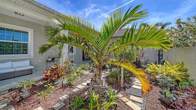 view of yard featuring an outdoor hangout area and fence