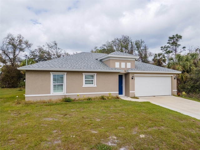 view of front of house with a garage and a front yard