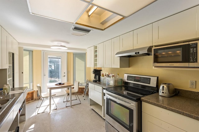 kitchen featuring white cabinetry, appliances with stainless steel finishes, and sink