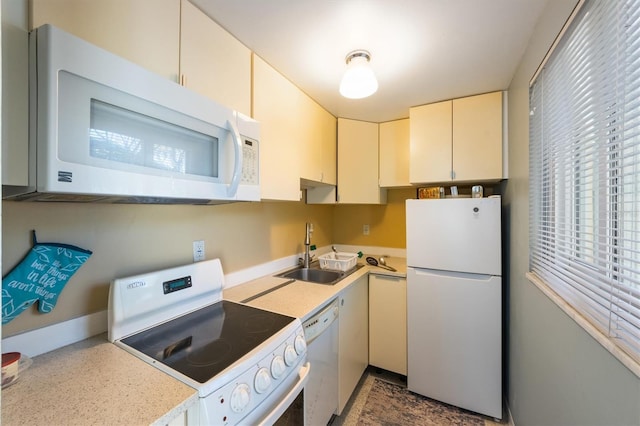 kitchen featuring sink and white appliances