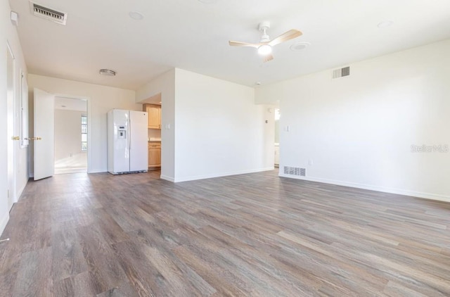 unfurnished living room with ceiling fan and wood-type flooring