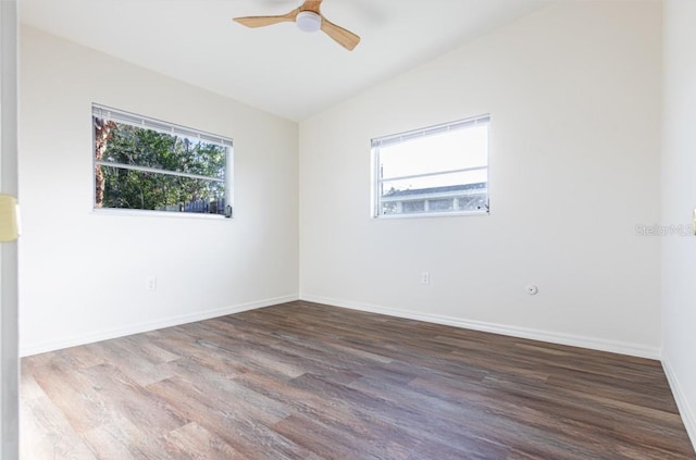 spare room featuring lofted ceiling, ceiling fan, and hardwood / wood-style flooring