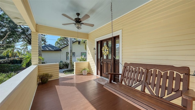 exterior space with a ceiling fan and a porch