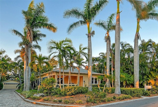 view of building exterior featuring a detached garage