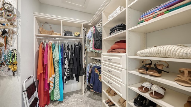 walk in closet featuring attic access
