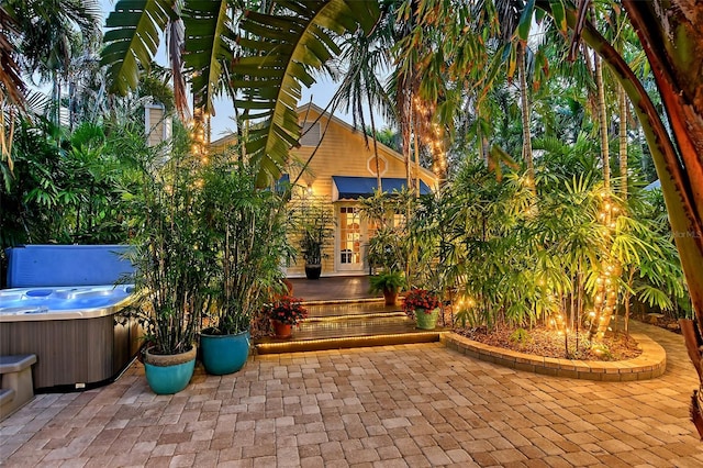 view of patio / terrace with a hot tub