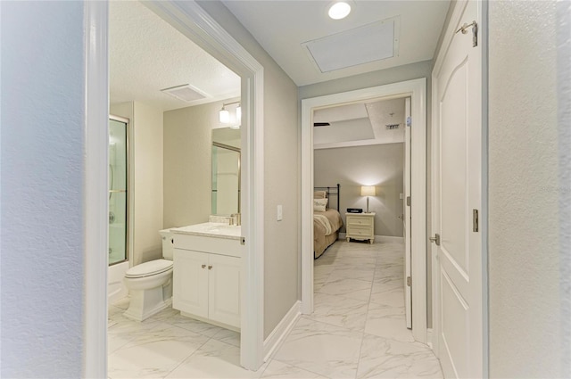 full bathroom with marble finish floor, vanity, visible vents, and baseboards