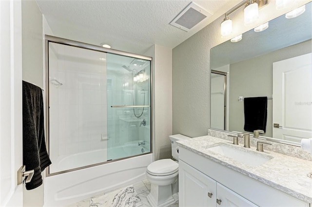 bathroom featuring visible vents, a textured wall, marble finish floor, a textured ceiling, and vanity