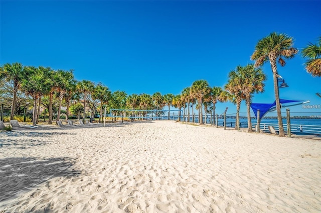 view of community featuring a water view and volleyball court