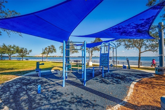 community playground with a water view and a yard