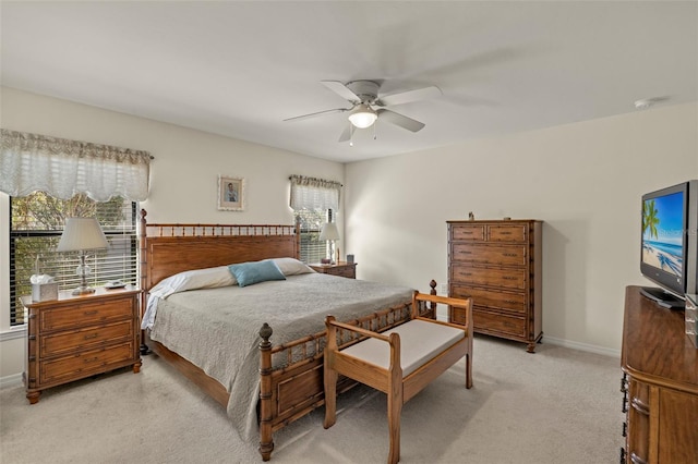 bedroom featuring light carpet and ceiling fan