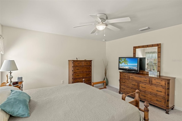 bedroom with ceiling fan and light colored carpet