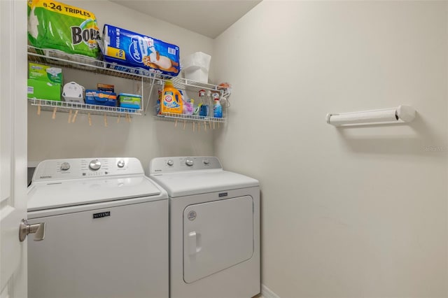 laundry room with separate washer and dryer