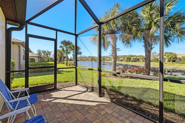 unfurnished sunroom with a water view and a healthy amount of sunlight