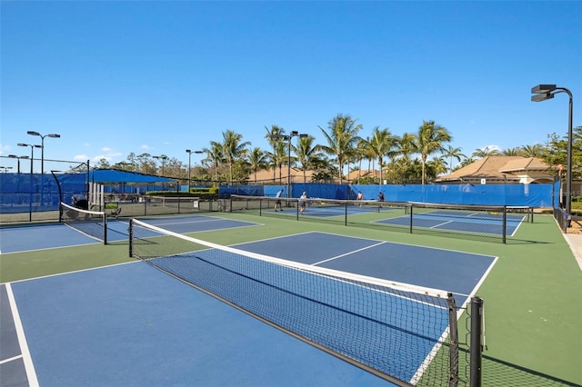 view of sport court with basketball hoop