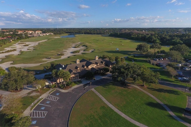 drone / aerial view with a residential view and golf course view