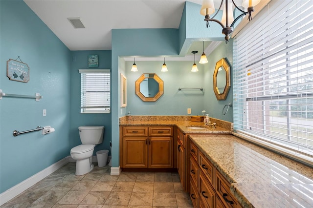 bathroom featuring visible vents, toilet, vanity, a chandelier, and baseboards