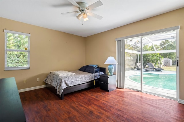 bedroom featuring access to exterior, baseboards, dark wood finished floors, and a ceiling fan