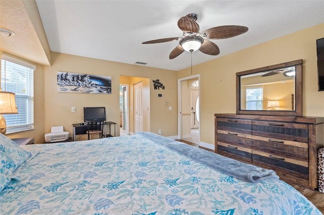 17368 Norseman Ave, Port Charlotte, FL 33948 - bedroom featuring baseboards, a ceiling fan, visible vents, and wood finished floors