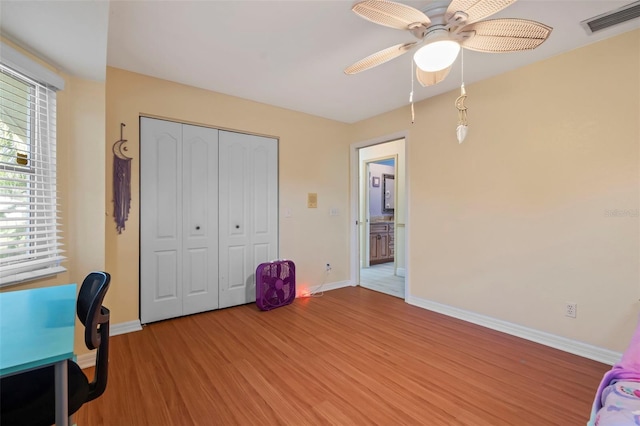 17368 Norseman Ave, Port Charlotte, FL 33948 - unfurnished office with baseboards, ceiling fan, light wood-style flooring, and visible vents