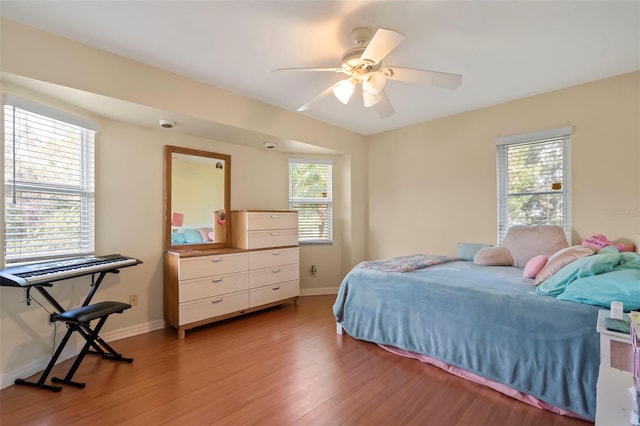 17368 Norseman Ave, Port Charlotte, FL 33948 - bedroom featuring multiple windows, light wood-style floors, and baseboards