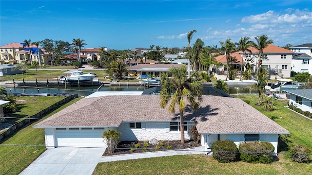 birds eye view of property featuring a water view