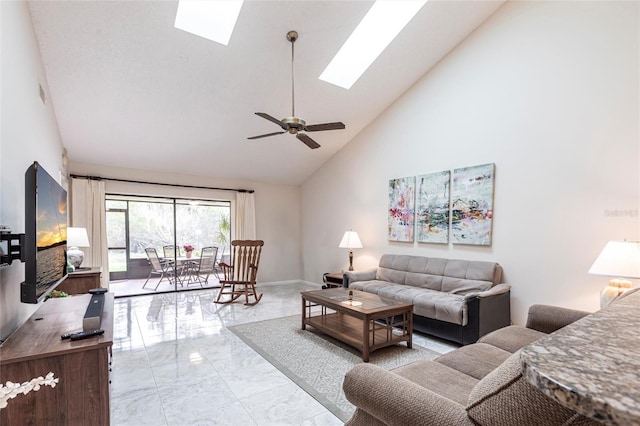 living area featuring ceiling fan, high vaulted ceiling, a skylight, baseboards, and marble finish floor