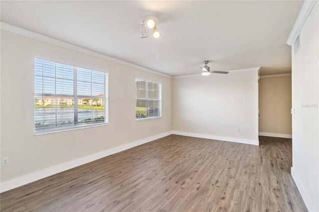 unfurnished room with light wood-type flooring, baseboards, ornamental molding, and ceiling fan