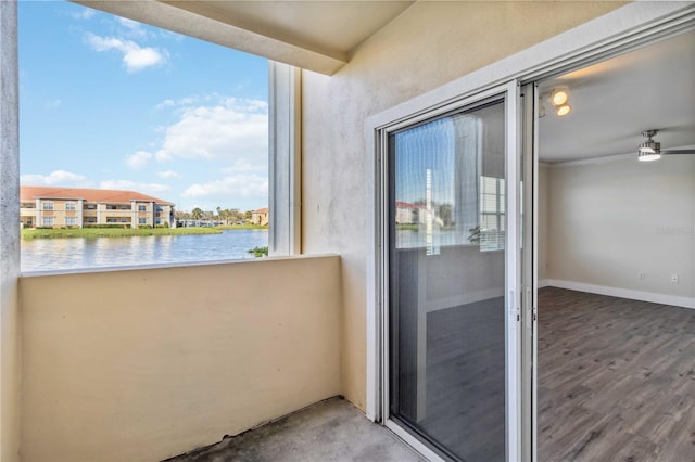 balcony featuring a water view