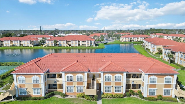 bird's eye view with a water view and a residential view