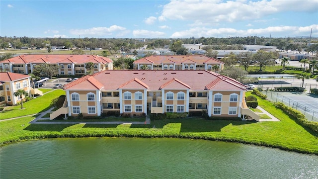 aerial view with a water view and a residential view