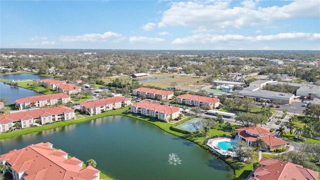 birds eye view of property with a residential view and a water view