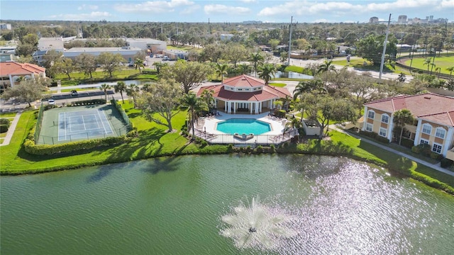 drone / aerial view with a water view and a residential view