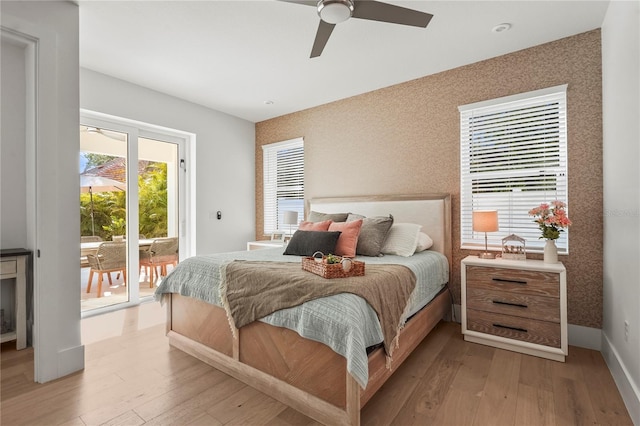 bedroom with baseboards, access to outside, light wood-style flooring, and wallpapered walls