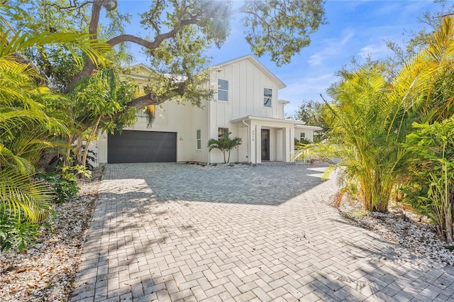 view of front of house featuring decorative driveway and board and batten siding