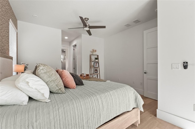 bedroom with recessed lighting, visible vents, light wood-style flooring, and a ceiling fan