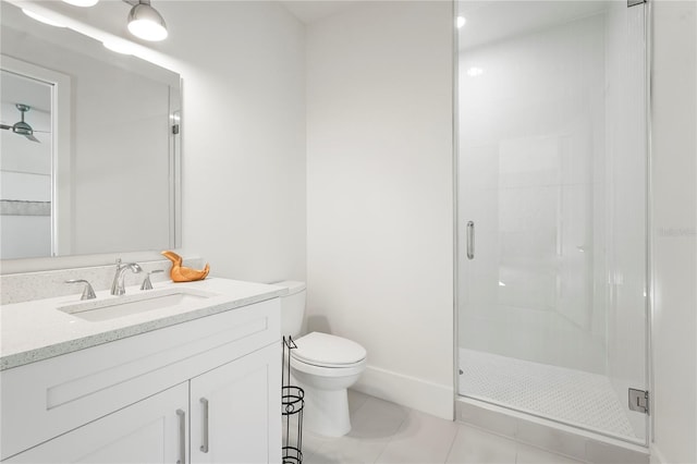 full bath featuring tile patterned flooring, a shower stall, toilet, vanity, and a ceiling fan