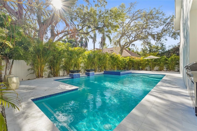 view of pool with a patio area, a fenced in pool, and a fenced backyard