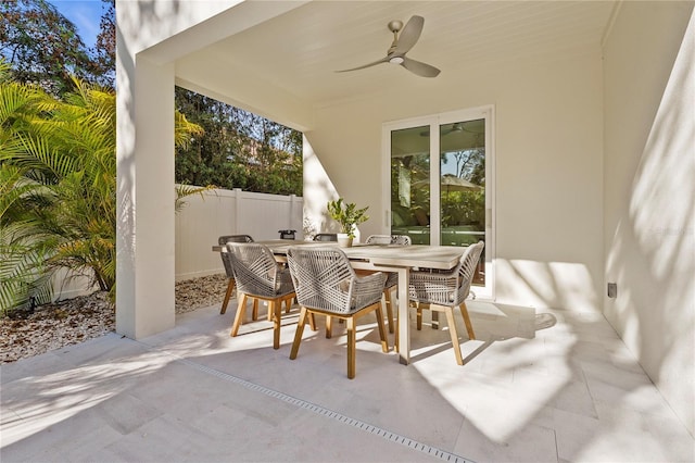 view of patio / terrace with outdoor dining space, a ceiling fan, and fence