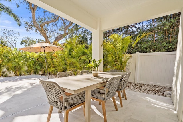 view of patio / terrace with outdoor dining area and fence