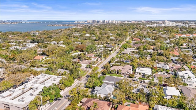 drone / aerial view with a residential view and a water view