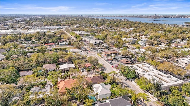 drone / aerial view featuring a residential view and a water view