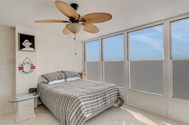 tiled bedroom with ceiling fan