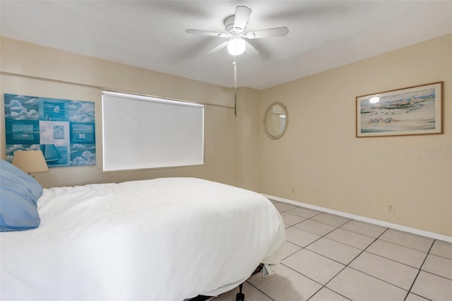 tiled bedroom with ceiling fan