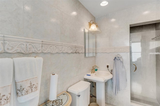 bathroom with toilet, tile walls, and tiled shower