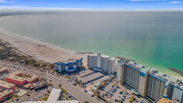 drone / aerial view with a beach view and a water view