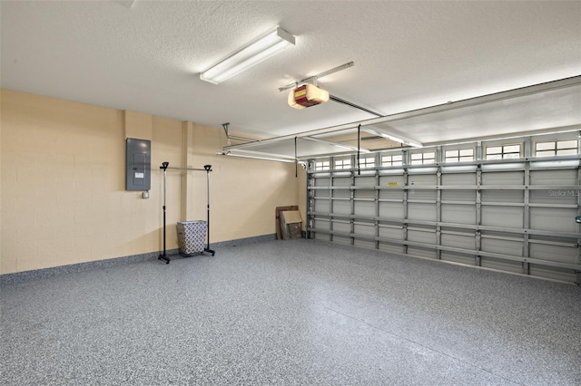 garage with electric panel and a garage door opener