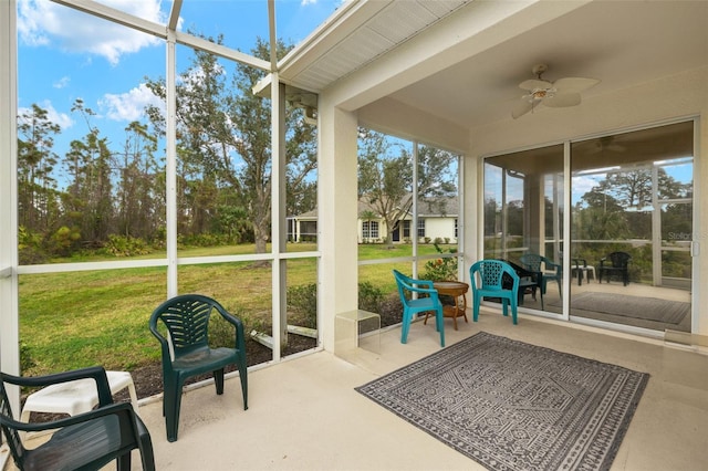 sunroom / solarium with ceiling fan